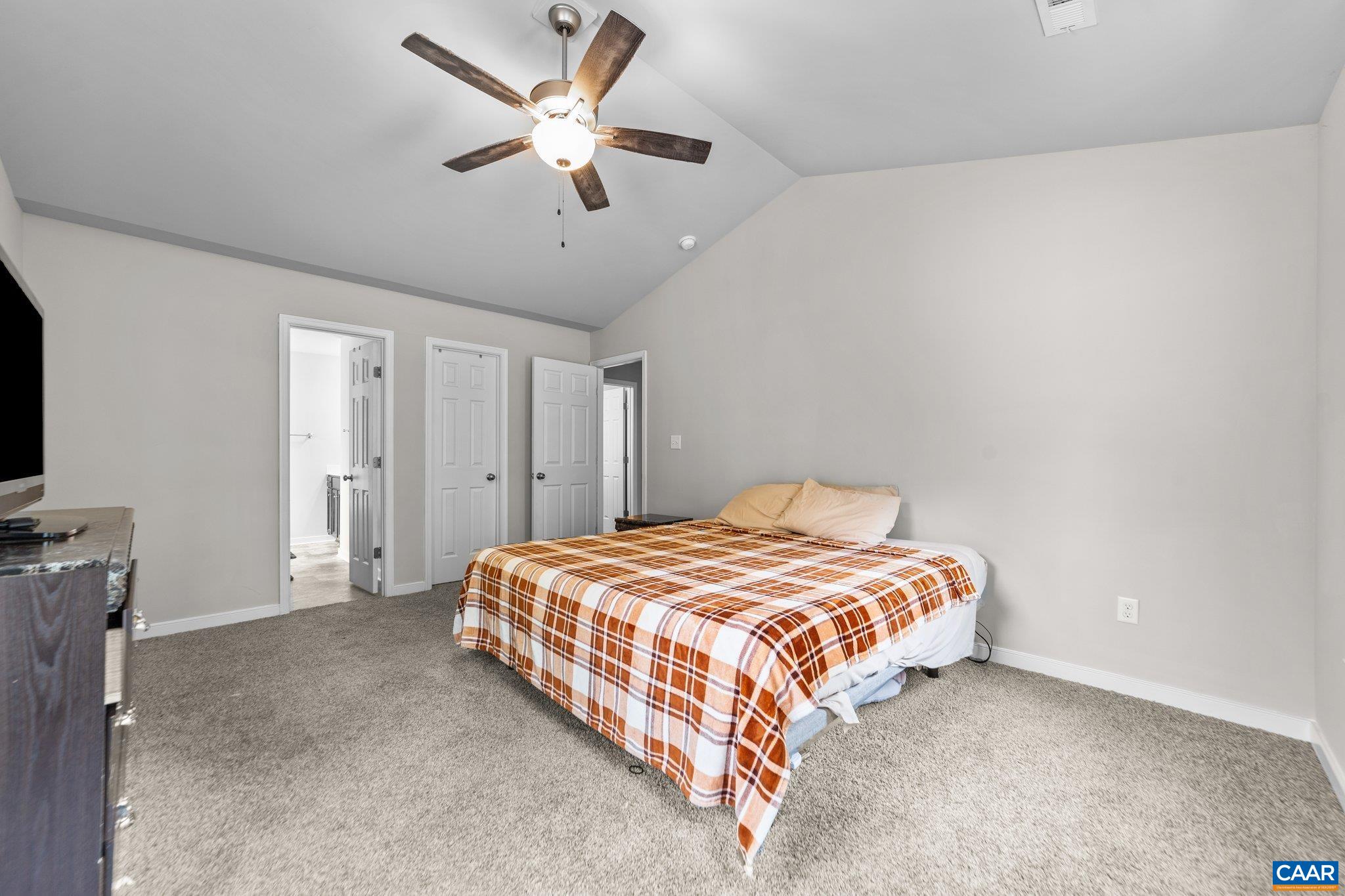 39 Amethyst Road Palmyra, VA 22963 - Photo 23 of 42 a bedroom with a bed and a ceiling fan