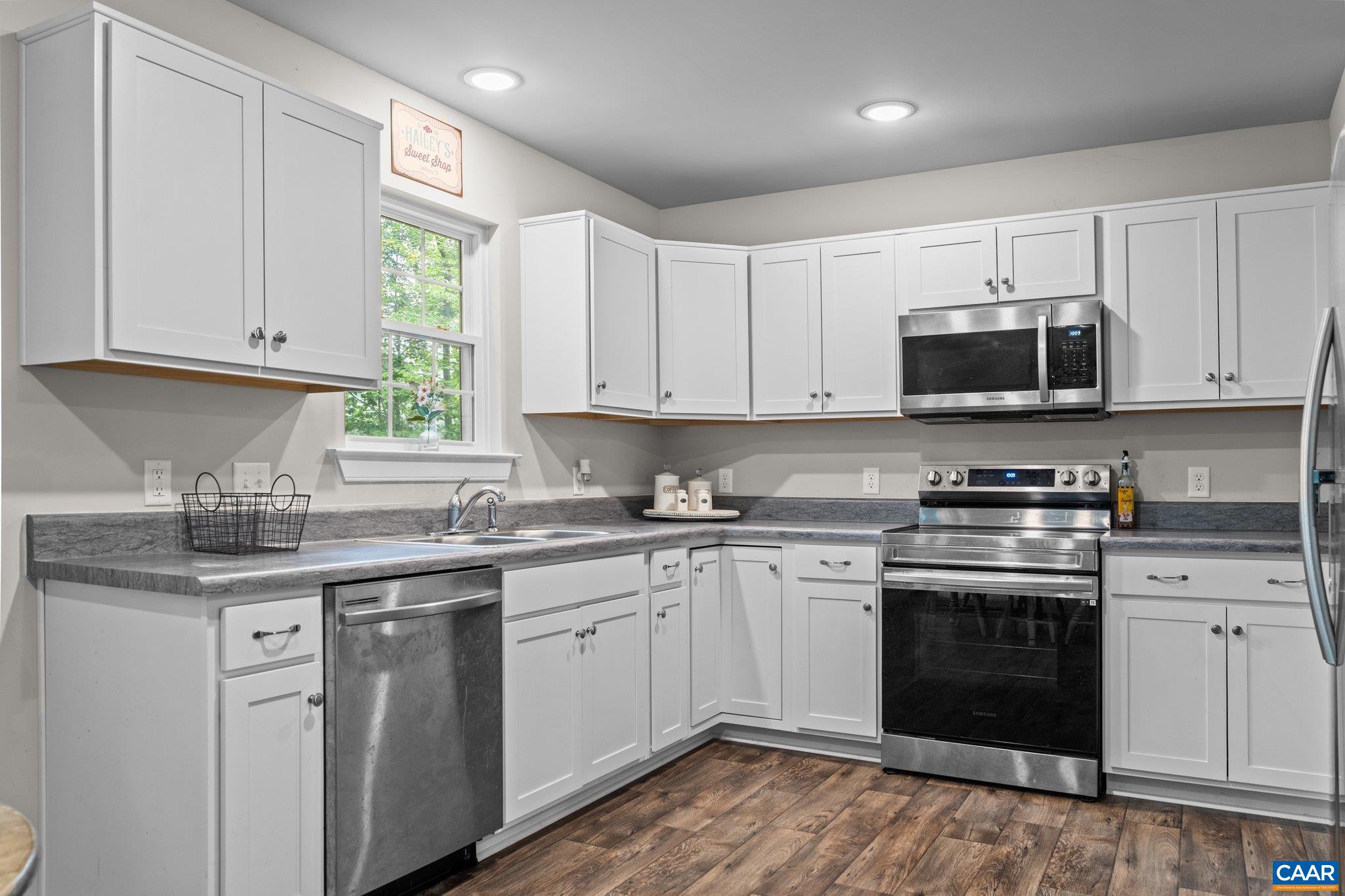 39 Amethyst Road Palmyra, VA 22963 - Photo 9 of 42 a kitchen with stainless steel appliances granite countertop a stove a sink and a microwave