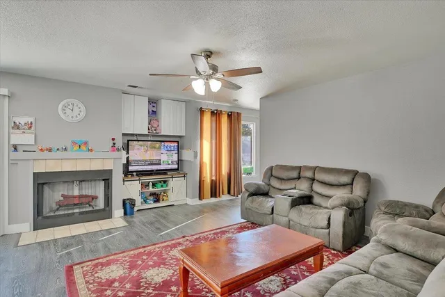 a living room with furniture and a fireplace
