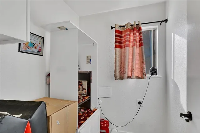 a bathroom with a shower and a sink