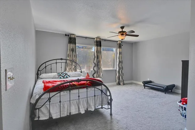 a bedroom with a bed and cabinets