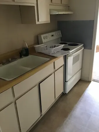 a close view of utility room and stove