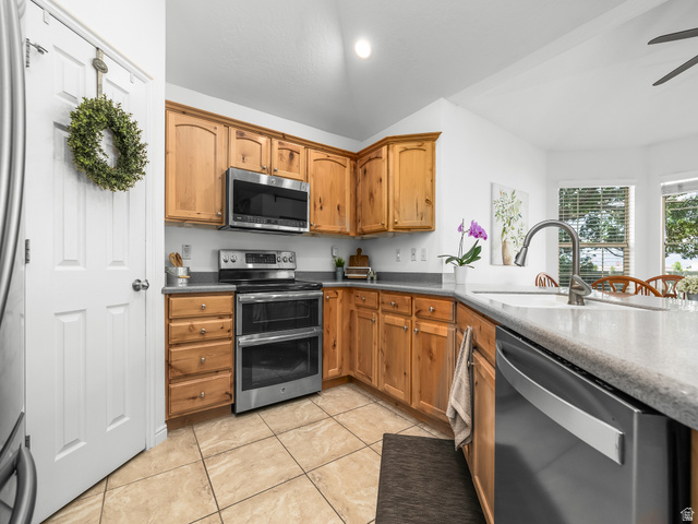 1602 Renaissance Way Springville, UT 84663 - Photo 10 of 42 Kitchen featuring wood cabinetry, stainless steel appliances, a double oven range, and a dual-basin sink with a gooseneck faucet