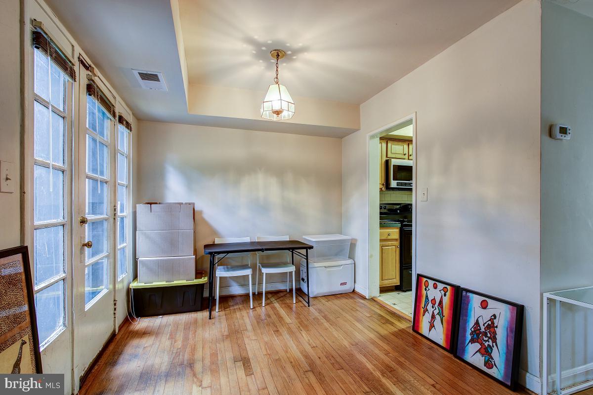 8621 Geren Road, Unit 297 Silver Spring, MD 20901 - Photo 12 of 30 Dining Area to have New Sliding Glass Door