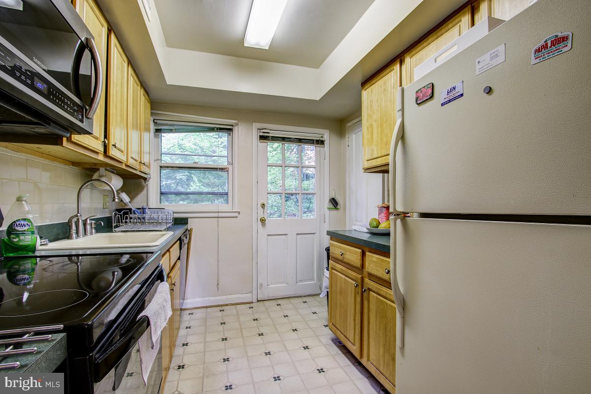 8621 Geren Road, Unit 297 Silver Spring, MD 20901 - Photo 13 of 30 Kitchen with Exterior Door and Window