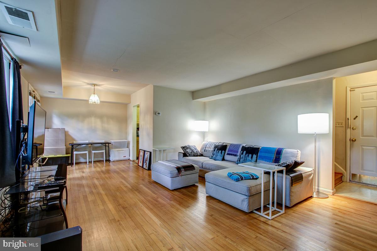 8621 Geren Road, Unit 297 Silver Spring, MD 20901 - Photo 8 of 30 Living Room opens the the Dining Area (DA)