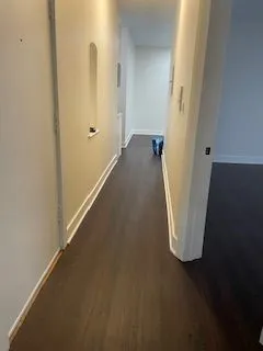 a view of a hallway with closet