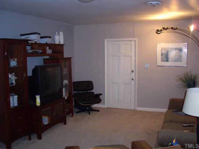 716 Chatham Lane Raleigh, NC 27610 - Photo 5 of 11 Need privacy to watch the BIG GAME? Lower level LR adjacent to possible office and/or exercise room Other