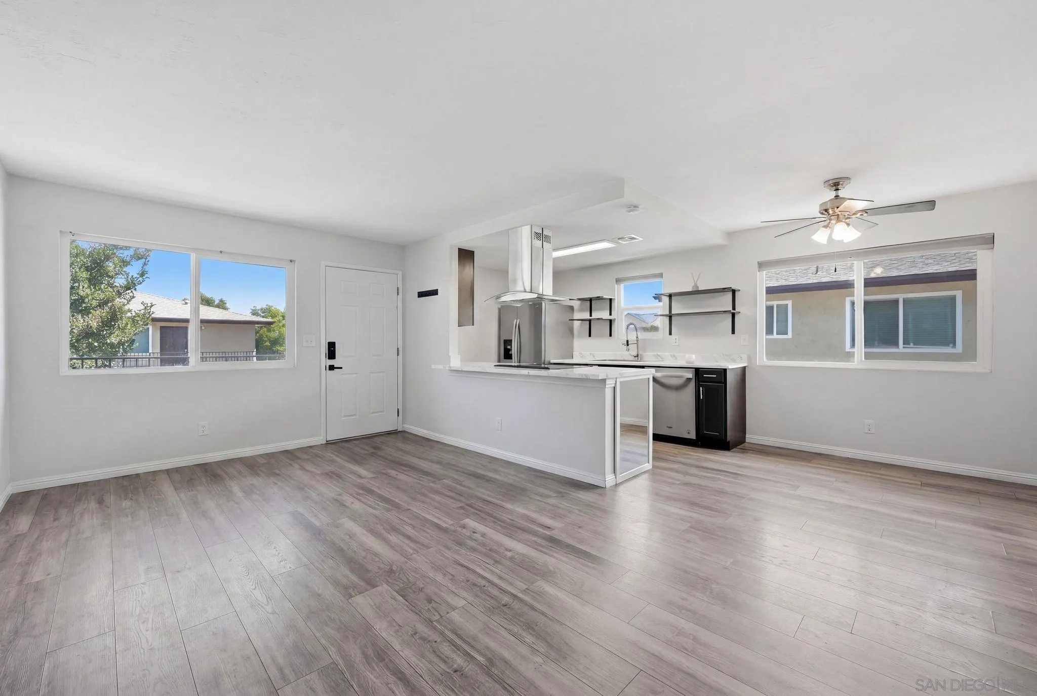 9926 Mission Vega Road, Unit 4 Santee, CA 92071 - Photo 8 of 30 a view of an empty room with a window and wooden floor