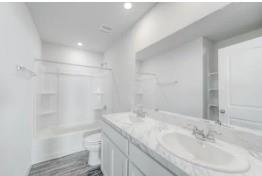 4610 Ranch Road Brownwood, TX 76801 - Photo 10 of 11 a bathroom with a sink toilet and shower