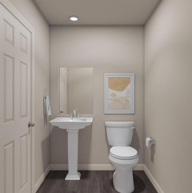 4610 Ranch Road Brownwood, TX 76801 - Photo 3 of 11 a bathroom with a toilet sink and mirror