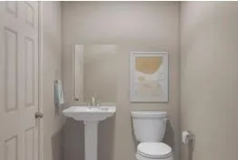 a bathroom with a sink a toilet and mirror