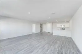 a view of a kitchen with wooden floor