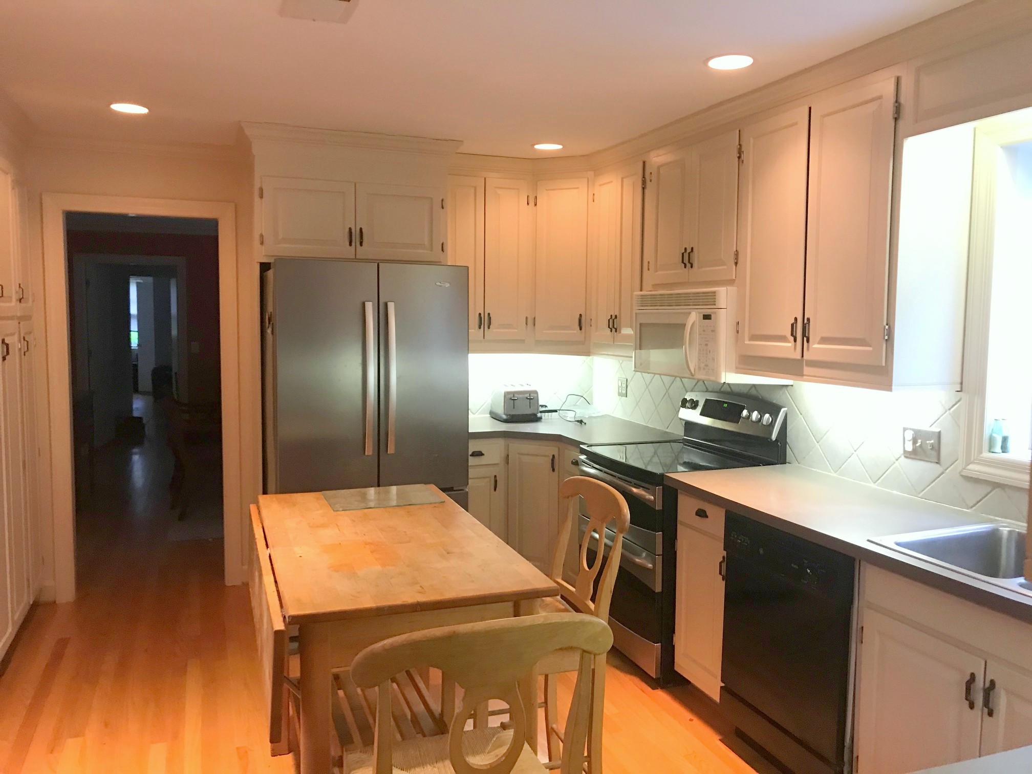 4129 Sneed Road Nashville, TN 37215 - Photo 5 of 5 a kitchen with stainless steel appliances granite countertop a sink a stove and a refrigerator