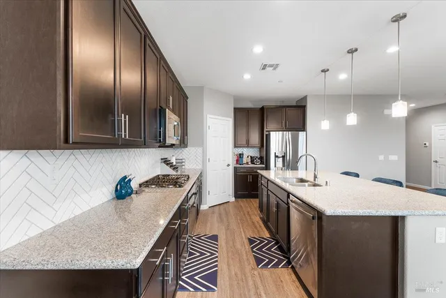 a kitchen with granite countertop lots of counter top space and a sink
