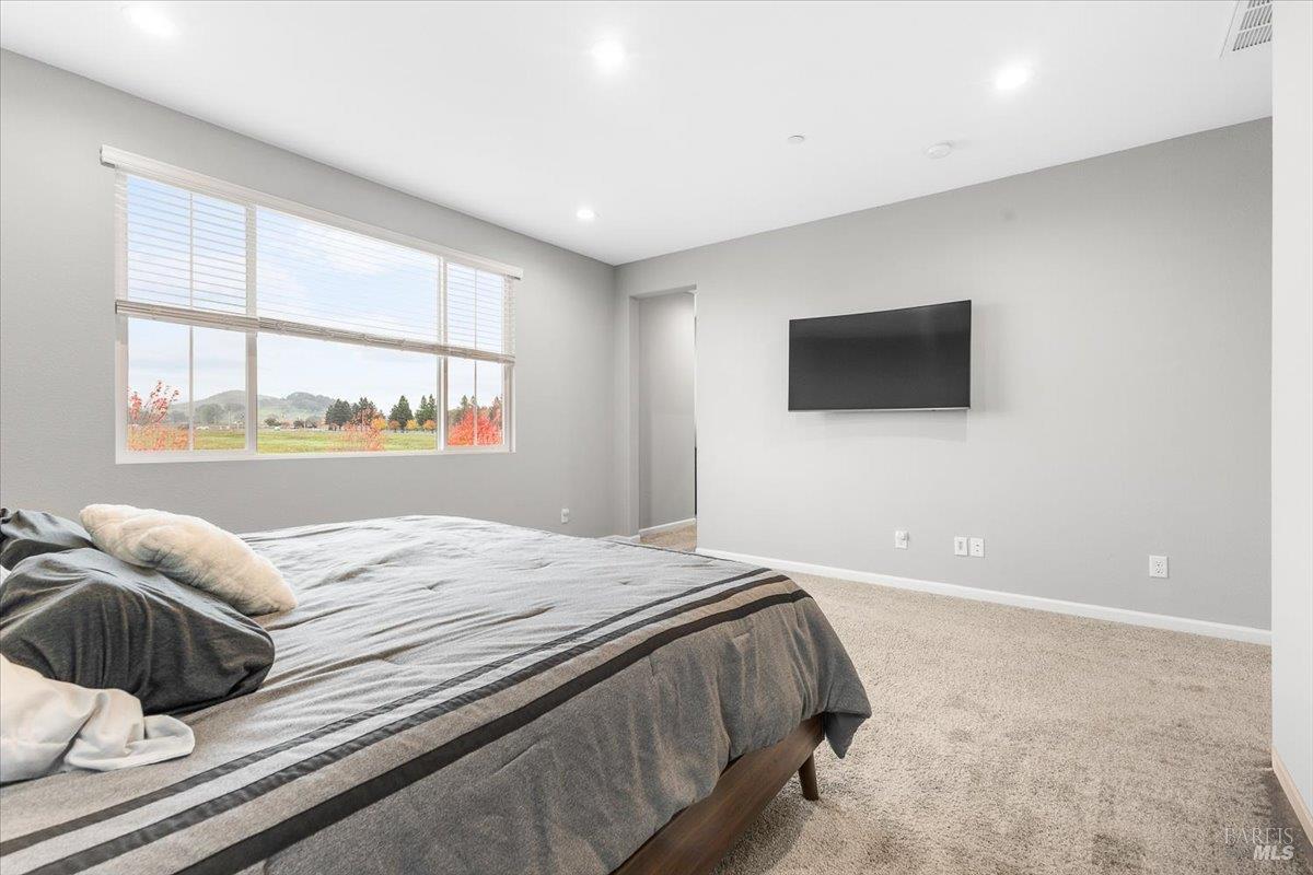 2180 Karen Place Rohnert Park, CA 94928 - Photo 23 of 48 a bedroom with a bed and a flat screen tv