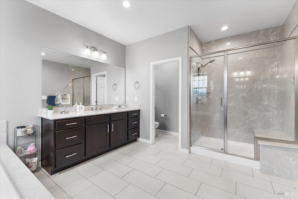 2180 Karen Place Rohnert Park, CA 94928 - Photo 28 of 48 a bathroom with a shower sink and mirror
