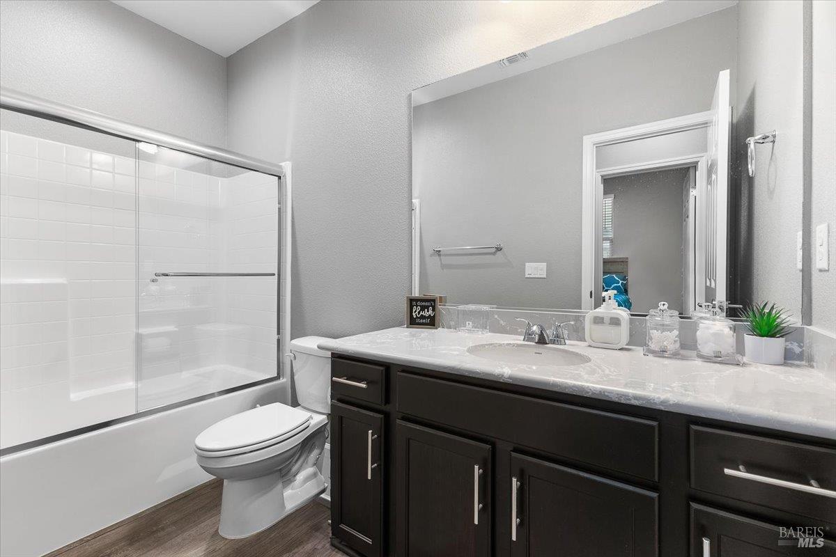 2180 Karen Place Rohnert Park, CA 94928 - Photo 39 of 48 a bathroom with a granite countertop sink toilet and shower
