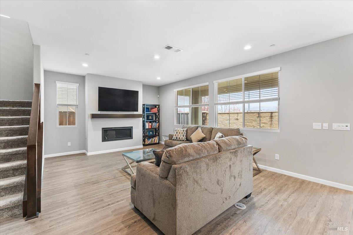 2180 Karen Place Rohnert Park, CA 94928 - Photo 7 of 48 a living room with furniture a flat screen tv and a fireplace