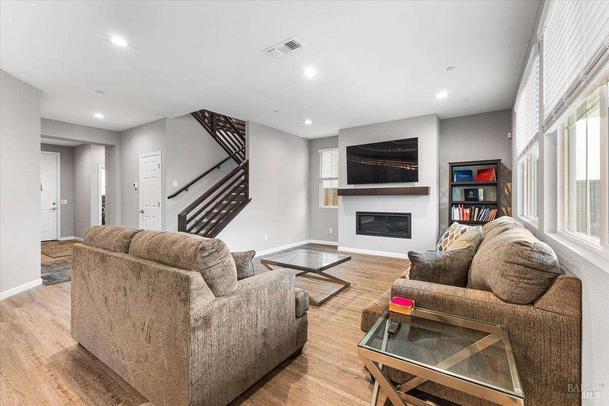 2180 Karen Place Rohnert Park, CA 94928 - Photo 10 of 48 a living room with furniture flat screen tv and a fireplace