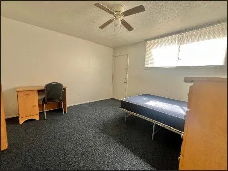 a room with a chair and a window