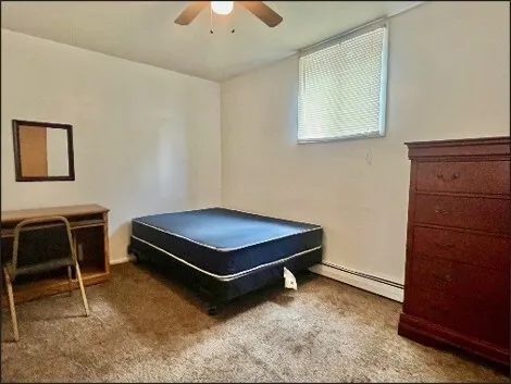 a room with pool table and a chair