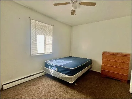 a room with chair and window