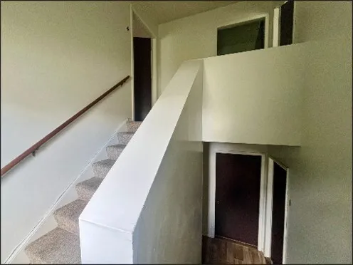 a view of a bathroom with a sink and mirror