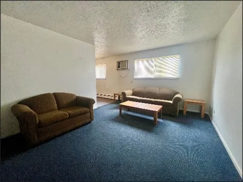 a kitchen with stainless steel appliances a refrigerator stove and microwave