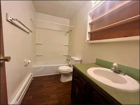 a room with a table and a ceiling fan