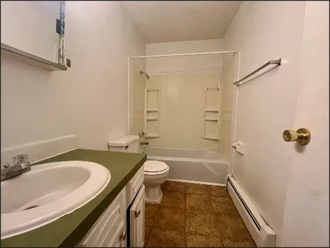 a room with pool table and a ceiling fan