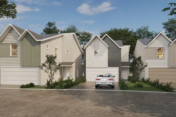 a view of backyard of the house and trees