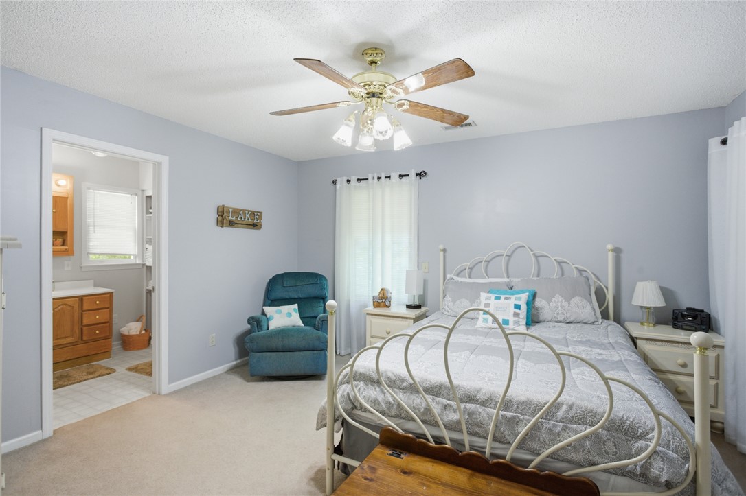 110 Snug Harbor Road Seneca, SC 29678 - Photo 15 of 37 This cozy bedroom offers a tranquil retreat with convenient access to a private bathroom.