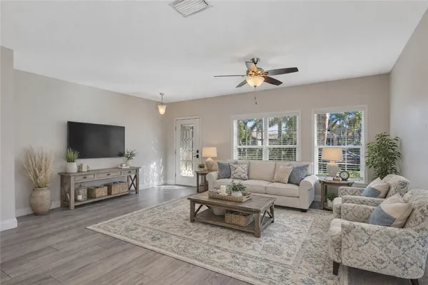 a living room with furniture and a flat screen tv