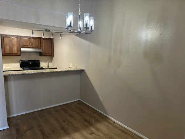 a view of a kitchen with a sink and dishwasher