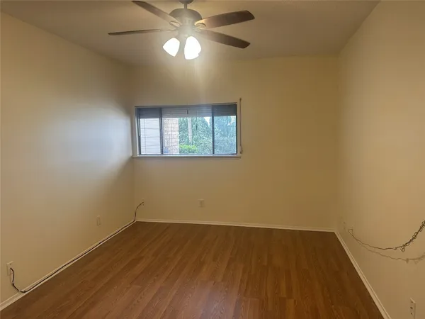 an empty room with a empty space and a window