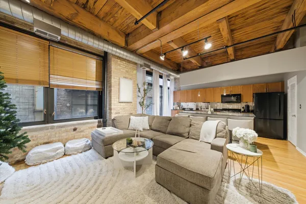 a living room with furniture and outdoor view