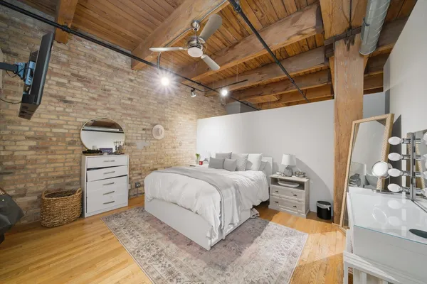 a bedroom with a bed and a view of walk in closet