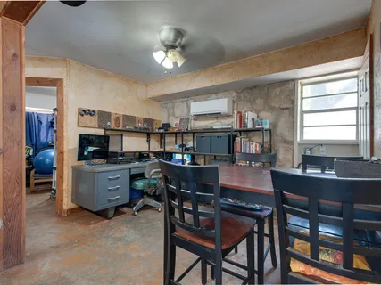 a view of a dining room with furniture and a kitchen