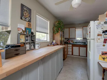 a kitchen with stainless steel appliances a sink stove and refrigerator