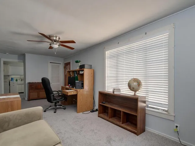 a work room with furniture and a window