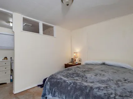 a bedroom with a bed and closet