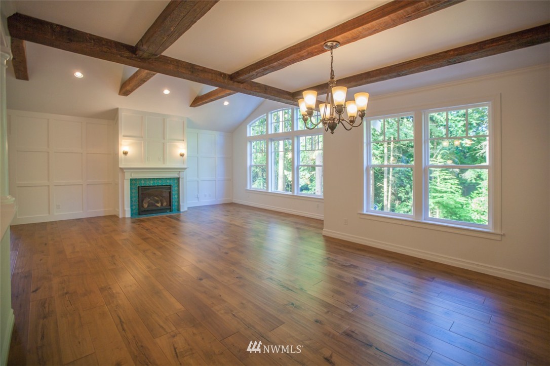 474 Whitecap Road Bellingham, WA 98229 - Photo 2 of 13 a view of an empty room with wooden floor and a window