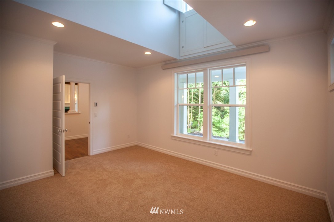474 Whitecap Road Bellingham, WA 98229 - Photo 4 of 13 an empty room with windows and closet