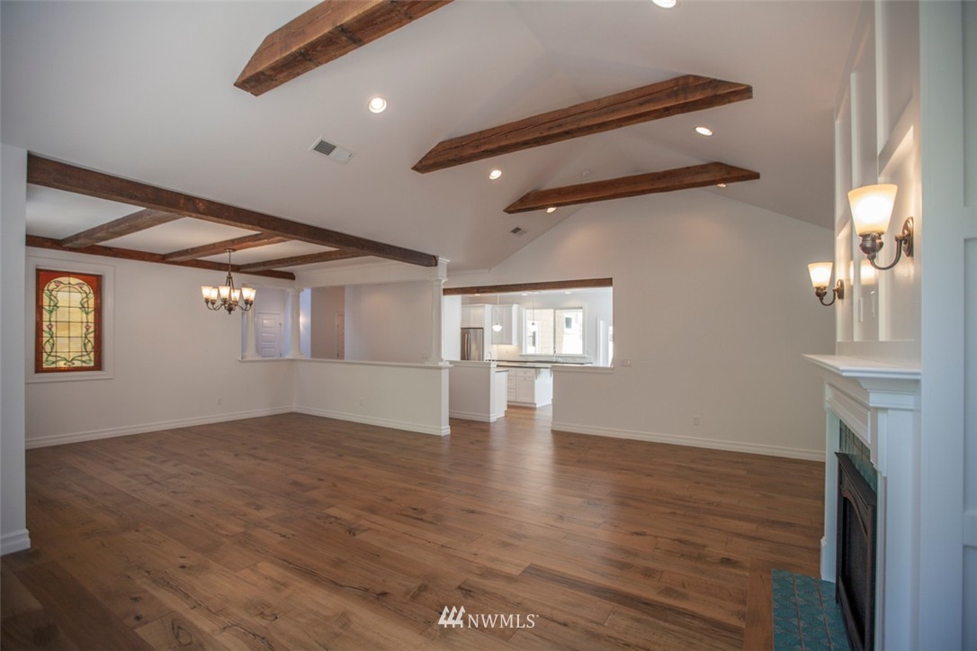 474 Whitecap Road Bellingham, WA 98229 - Photo 10 of 13 a view of an empty room with a window and wooden floor