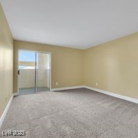 698 South Racetrack Road, Unit 412 Henderson, NV 89015 - Photo 11 of 25 Unfurnished bedroom with carpet flooring and baseboards