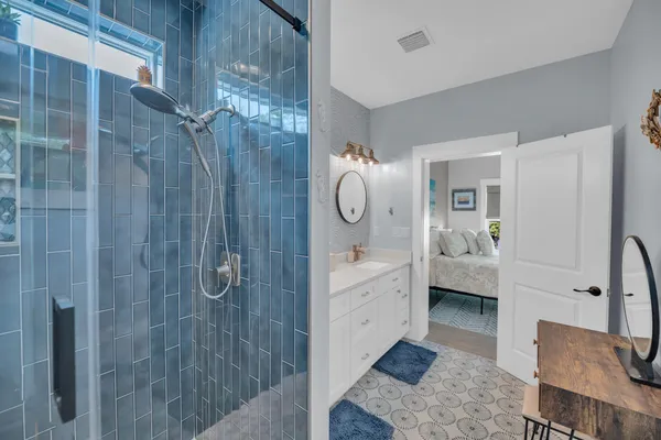 a bedroom with a bed and a painting on the wall