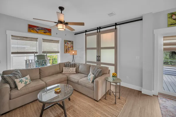 a living room with furniture and a large window
