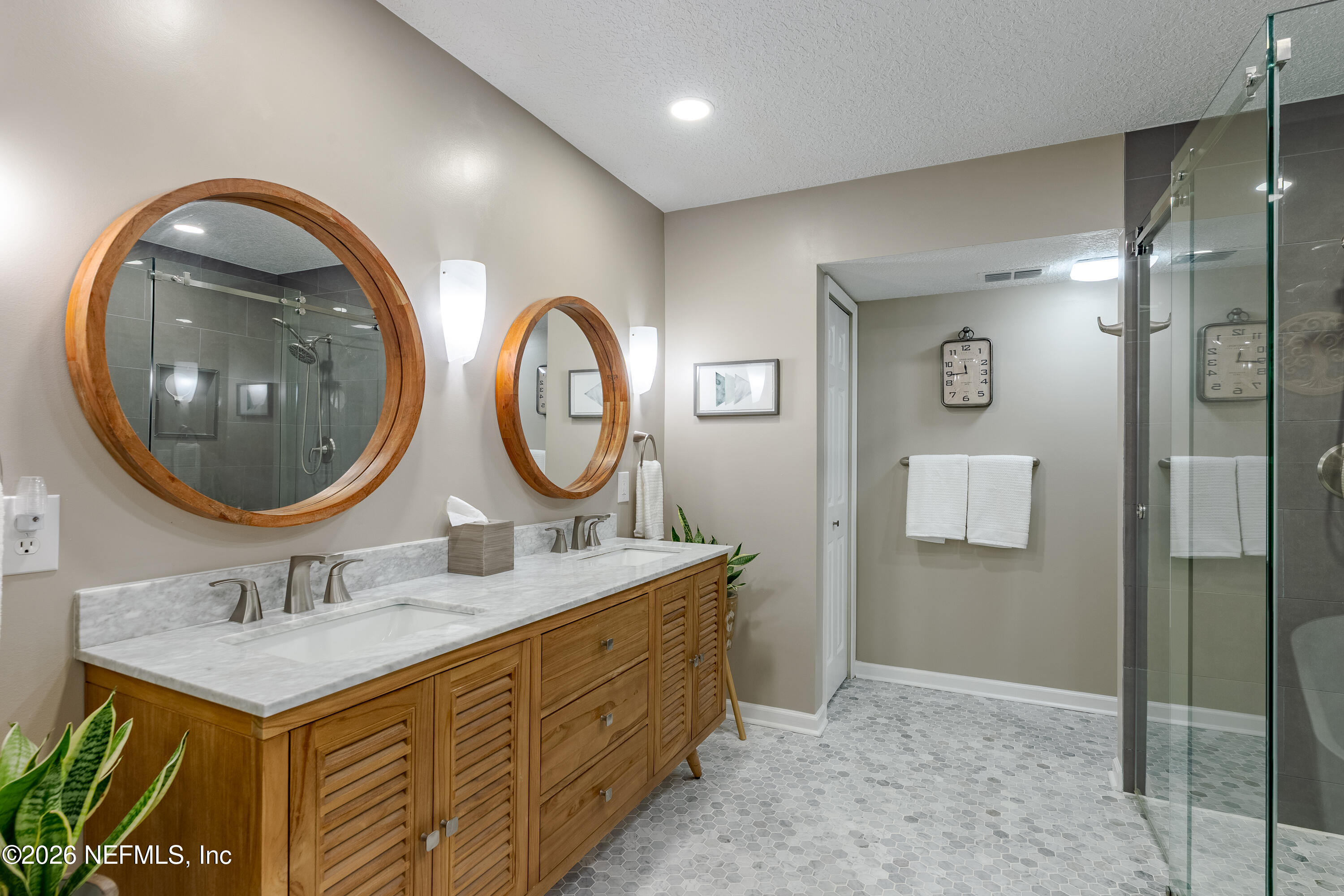 3327 Lighthouse Point Lane Jacksonville, FL 32250 - Photo 17 of 56 a bathroom with a sink and a mirror