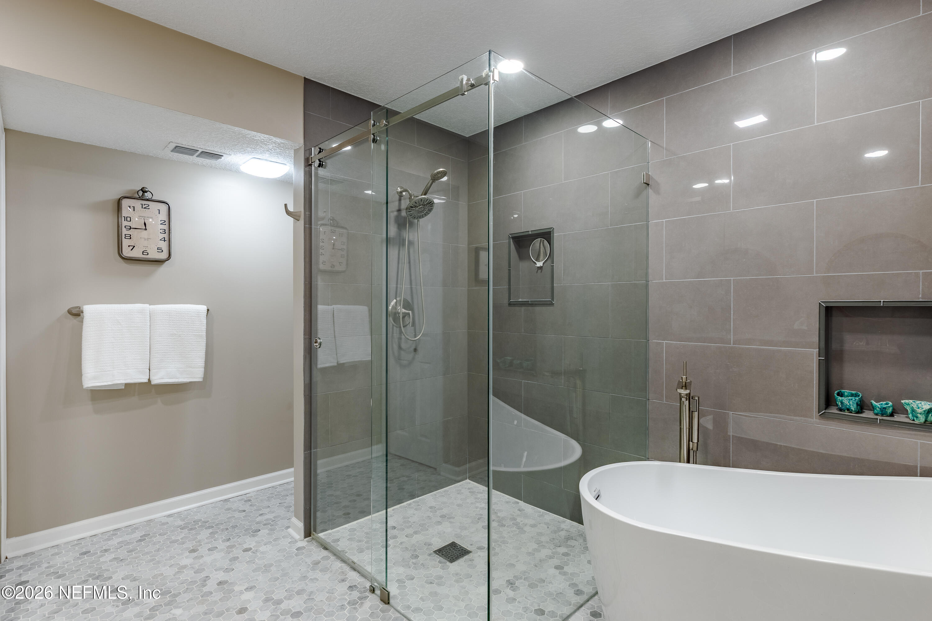 3327 Lighthouse Point Lane Jacksonville, FL 32250 - Photo 18 of 56 a bathroom with a shower a toilet and sink